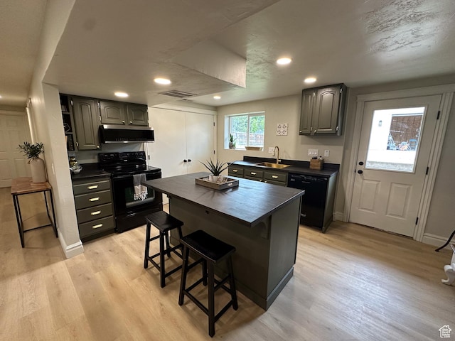 1391 E Mccormick Way, Cottonwood Heights, UT 84121 - kitchen with black appliances, a sink, range hood, light wood finished floors, and recessed lighting
