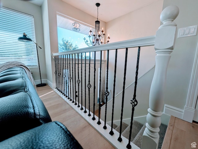 1391 E Mccormick Way, Cottonwood Heights, UT 84121 - stairway with wood finished floors, a chandelier, and baseboards