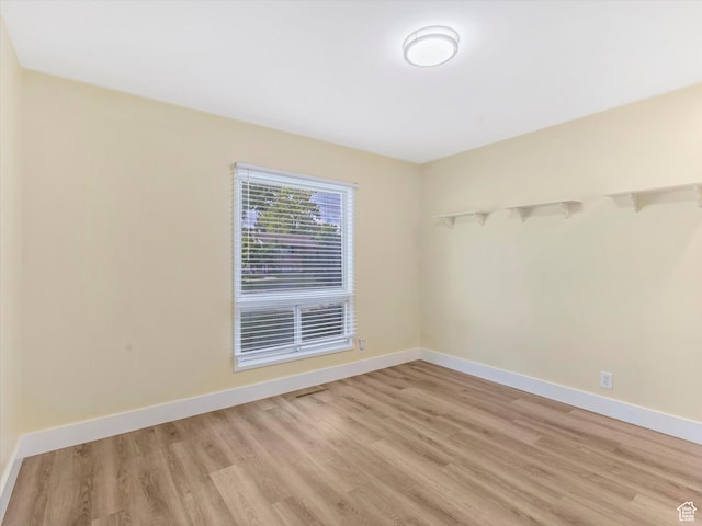 1429 E Sumac Way, Murray, UT 84121 - spare room featuring light wood finished floors and baseboards