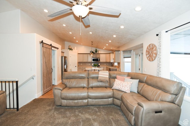 3155 S Autumn Blaze Cv W, West Valley City, UT 84128 - carpeted living area with recessed lighting, a barn door, ceiling fan, and lofted ceiling