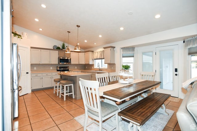 3155 S Autumn Blaze Cv W, West Valley City, UT 84128 - dining space featuring light tile patterned floors, healthy amount of natural light, lofted ceiling, and recessed lighting