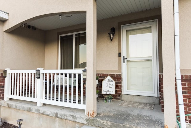 3155 S Autumn Blaze Cv W, West Valley City, UT 84128 - property entrance featuring stucco siding and a porch