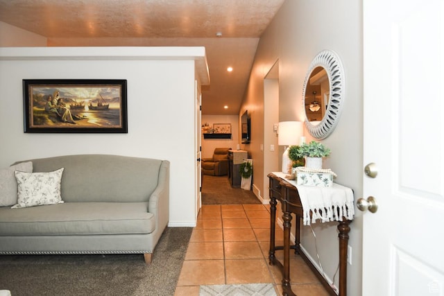 3155 S Autumn Blaze Cv W, West Valley City, UT 84128 - living area featuring light tile patterned floors, baseboards, recessed lighting, and light colored carpet