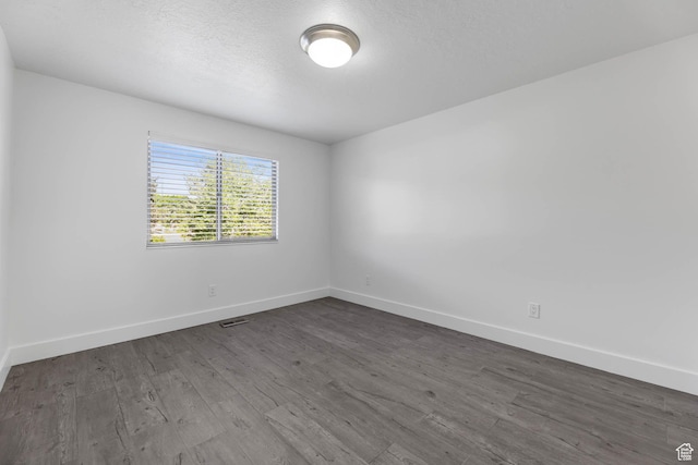 1298 S 500 E, Kaysville, UT 84037 - empty room featuring baseboards, dark wood-style floors, and a textured ceiling