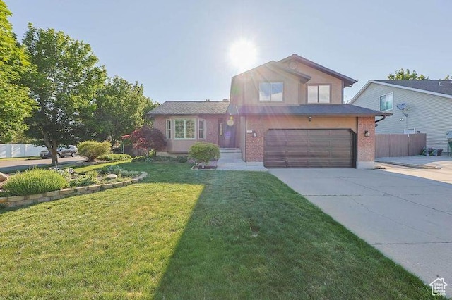 1298 S 500 E, Kaysville, UT 84037 - view of front of house featuring an attached garage, concrete driveway, and brick siding