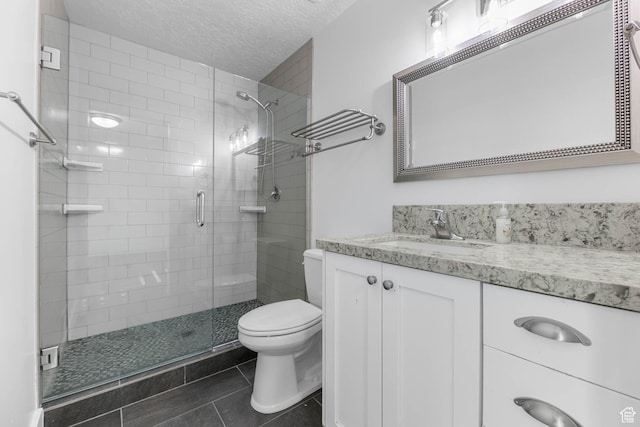 1298 S 500 E, Kaysville, UT 84037 - bathroom with toilet, a shower stall, a textured ceiling, tile patterned flooring, and vanity