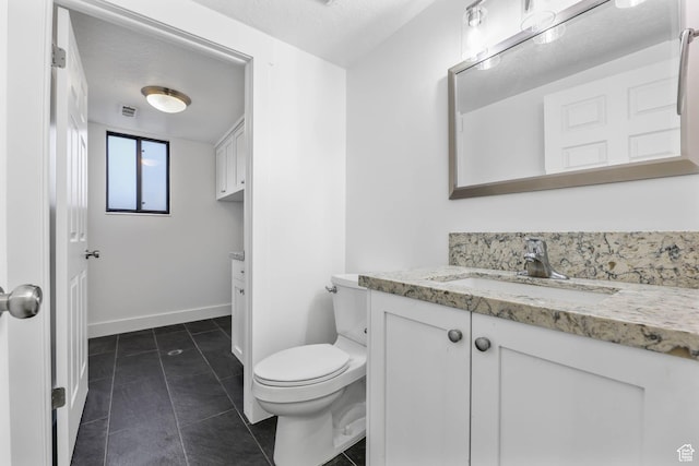 1298 S 500 E, Kaysville, UT 84037 - half bathroom featuring vanity, toilet, tile patterned flooring, baseboards, and a textured ceiling