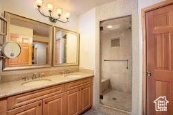3000 Canyons Resort Dr Unit 10-602, Park City, UT 84098 - full bathroom featuring a chandelier, double vanity, and a shower