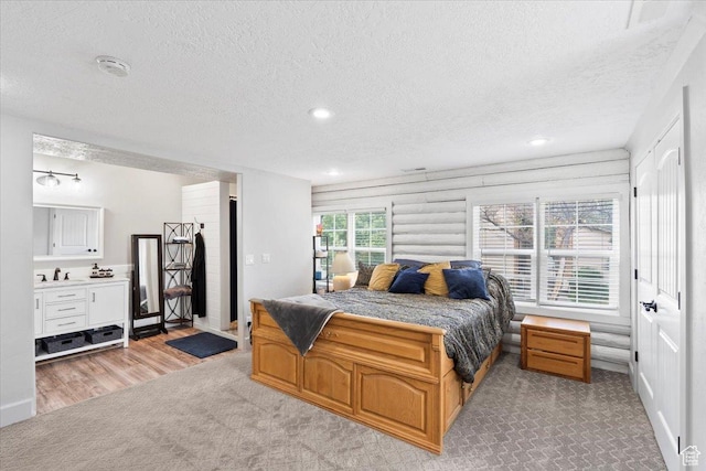 2899 W 8870 S, West Jordan, UT 84088 - bedroom with a textured ceiling, recessed lighting, a sink, and light carpet