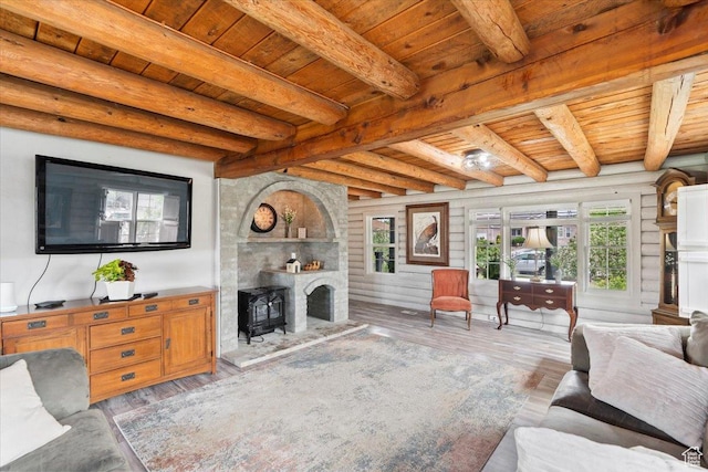 2899 W 8870 S, West Jordan, UT 84088 - living room with wooden ceiling with exposed beams, healthy amount of natural light, wood finished floors, and a wood stove