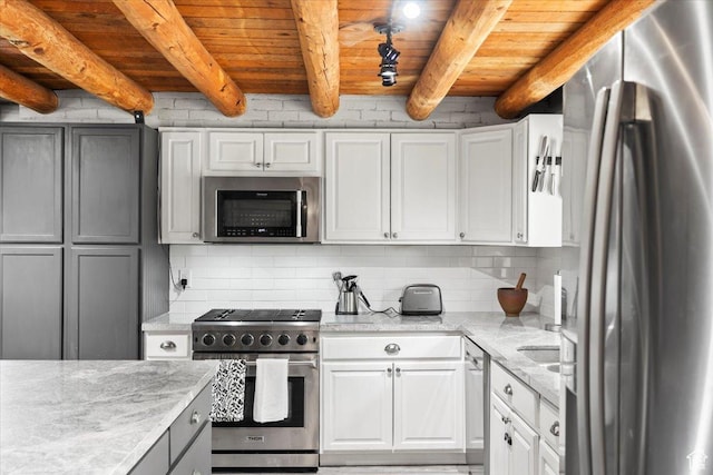 2899 W 8870 S, West Jordan, UT 84088 - kitchen with appliances with stainless steel finishes, decorative backsplash, wooden ceiling with exposed beams, white cabinetry, and light stone counters