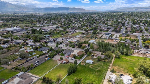 2899 W 8870 S, West Jordan, UT 84088 - aerial view of property and surrounding area with a mountainous background and nearby suburban area