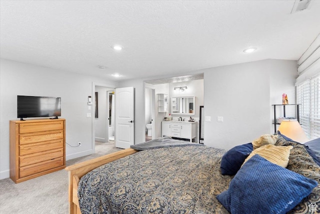 2899 W 8870 S, West Jordan, UT 84088 - bedroom featuring light colored carpet, a textured ceiling, ensuite bathroom, baseboards, and recessed lighting