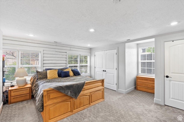 2899 W 8870 S, West Jordan, UT 84088 - bedroom with light carpet, a textured ceiling, recessed lighting, and baseboards