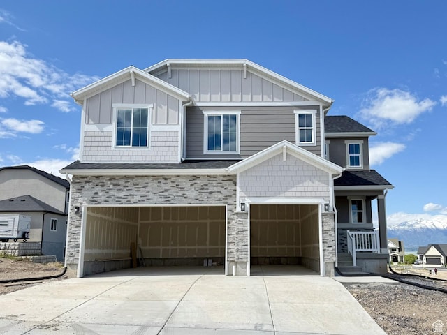 132 E Heron Ave S Unit 806, Saratoga Springs, UT 84045 - craftsman-style house with an attached garage, stone siding, driveway, board and batten siding, and a porch