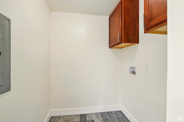210 W 1 N, Preston, ID 83263 - washroom with cabinet space, washer hookup, dark wood finished floors, and baseboards