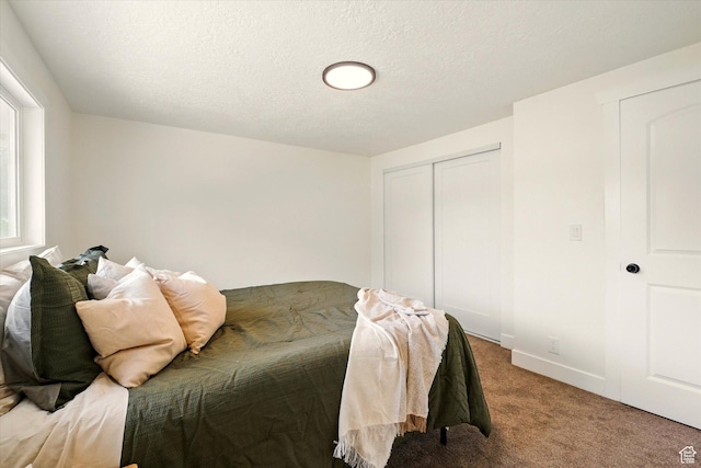 210 W 1 N, Preston, ID 83263 - bedroom featuring carpet, a closet, a textured ceiling, and baseboards