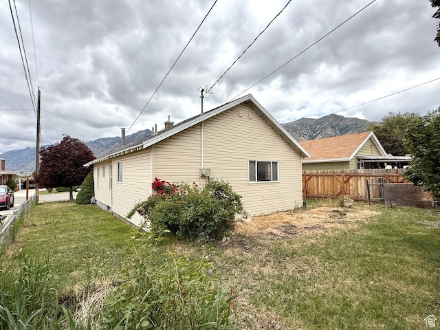 view of property exterior featuring a mountain view