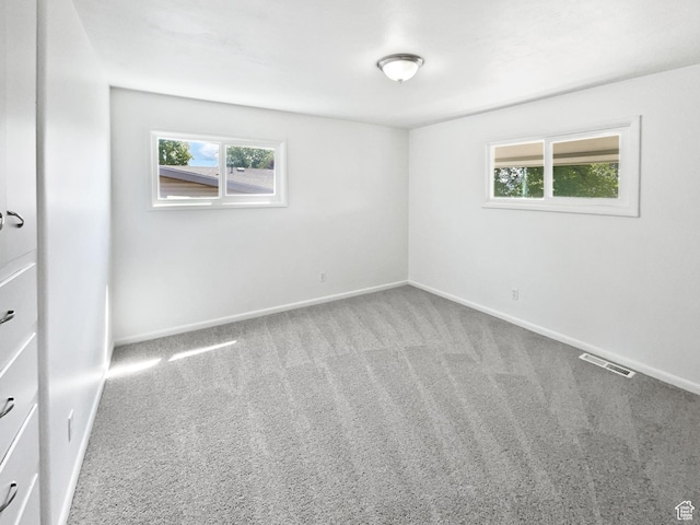 2959 W 1300 N, Clinton, UT 84015 - carpeted empty room with plenty of natural light and baseboards