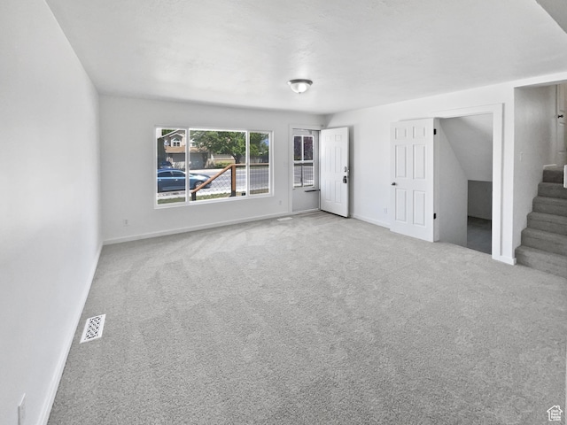 2959 W 1300 N, Clinton, UT 84015 - unfurnished living room featuring carpet floors, stairs, and baseboards