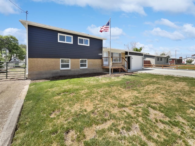 2959 W 1300 N, Clinton, UT 84015 - view of front of home with brick siding, a garage, and concrete driveway