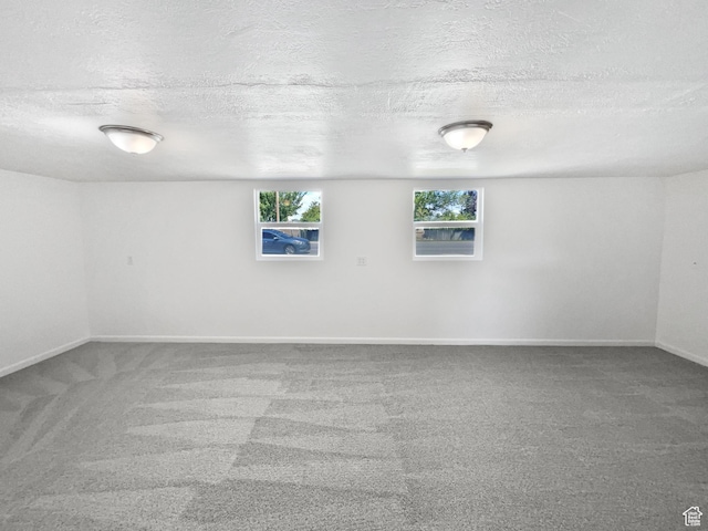 2959 W 1300 N, Clinton, UT 84015 - spare room featuring carpet flooring, a textured ceiling, and baseboards