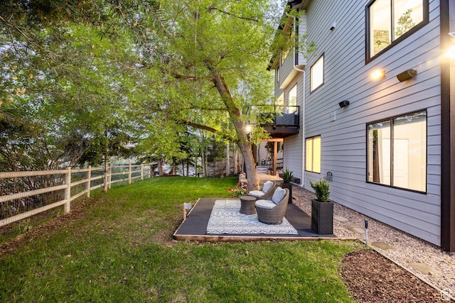 view of yard featuring a patio area and a balcony