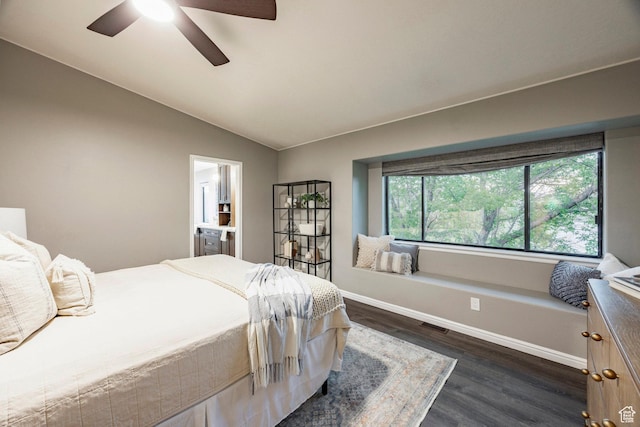 bedroom featuring dark wood-style flooring, lofted ceiling, baseboards, and a ceiling fan