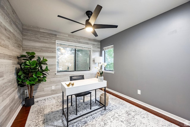 office with ceiling fan, baseboards, and wood finished floors