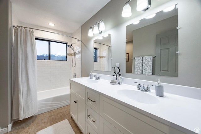 full bath with shower / tub combo with curtain and double vanity