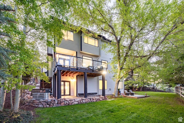 back of house featuring a patio and a balcony