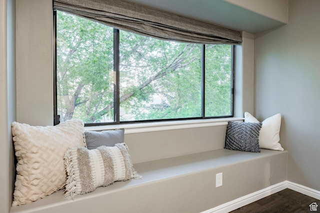 living area featuring dark wood finished floors and baseboards