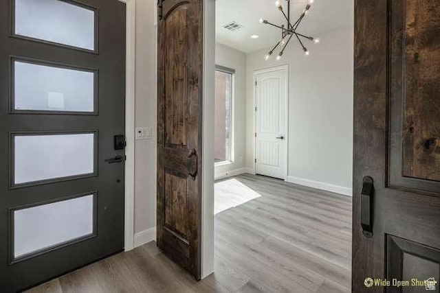 3208 S Sand Stone Dr, Hurricane, UT 84737 - foyer featuring a chandelier, baseboards, and wood finished floors
