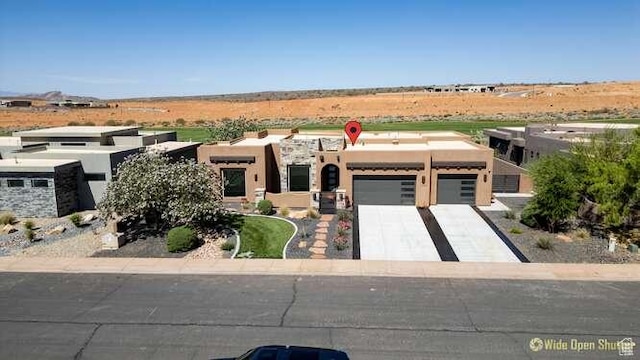 3208 S Sand Stone Dr, Hurricane, UT 84737 - view of front of home featuring an attached garage, stucco siding, and driveway