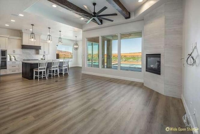 3208 S Sand Stone Dr, Hurricane, UT 84737 - living room with baseboards, dark wood finished floors, ceiling fan, recessed lighting, and beam ceiling