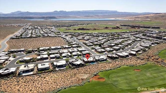 3208 S Sand Stone Dr, Hurricane, UT 84737 - aerial view of residential area featuring a golf course and a mountain backdrop
