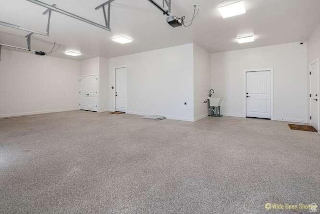 3208 S Sand Stone Dr, Hurricane, UT 84737 - garage featuring a garage door opener and baseboards