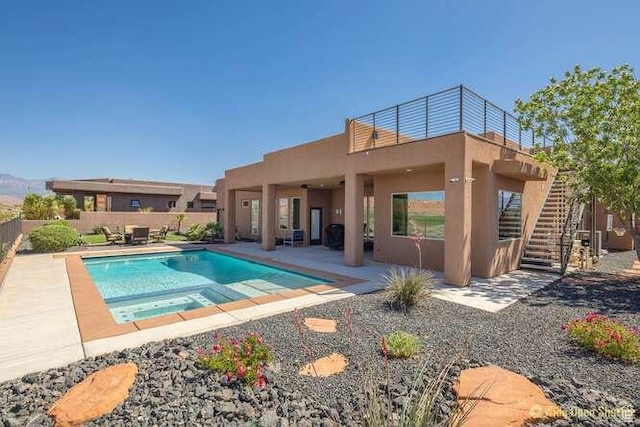 3208 S Sand Stone Dr, Hurricane, UT 84737 - view of swimming pool with a patio, a fenced backyard, stairs, and a pool with connected hot tub