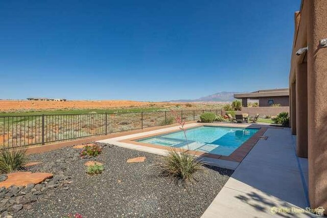 3208 S Sand Stone Dr, Hurricane, UT 84737 - view of pool featuring a fenced backyard, a patio area, and a mountain view