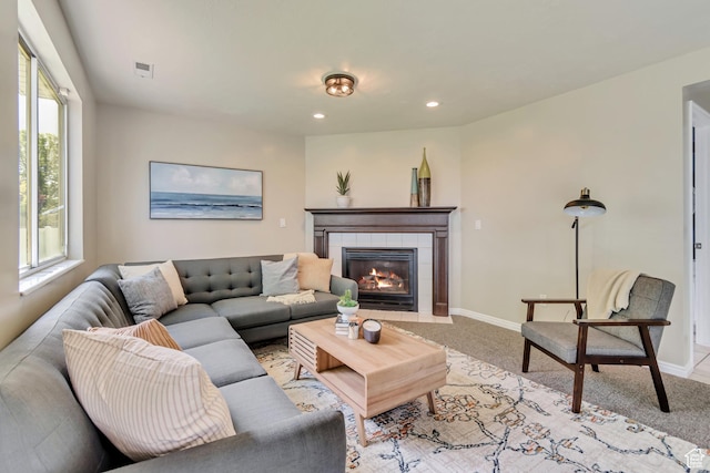 2057 W Marblewood Dr, Riverton, UT 84065 - living area with light colored carpet, plenty of natural light, a tiled fireplace, and recessed lighting