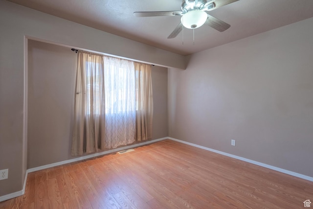 328 Hillcrest Cir, Central, UT 84722 - unfurnished room with baseboards, light wood-type flooring, and ceiling fan