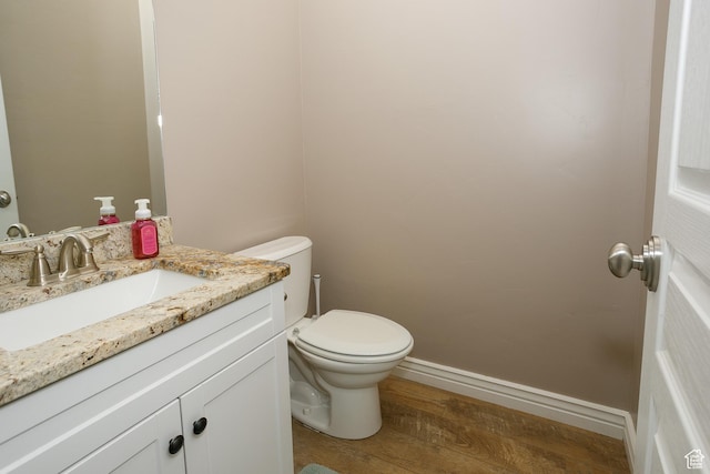 161 S 2775 W, West Point, UT 84015 - half bathroom with wood finished floors, toilet, vanity, and baseboards