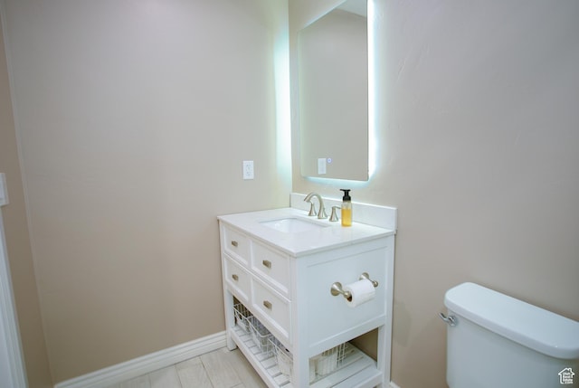 161 S 2775 W, West Point, UT 84015 - bathroom featuring toilet, vanity, and baseboards