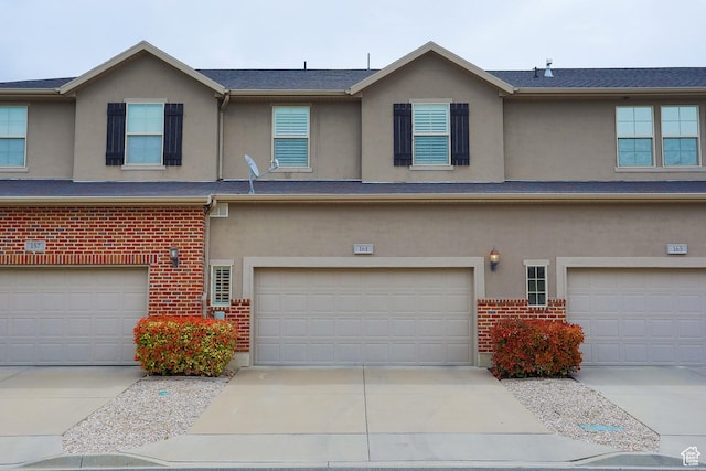 161 S 2775 W, West Point, UT 84015 - multi unit property with a garage, brick siding, stucco siding, and concrete driveway