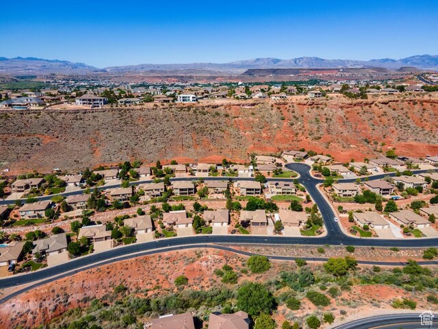8 S Arroyo Dr, St George, UT 84790 - aerial view of property and surrounding area featuring a mountain backdrop and nearby suburban area