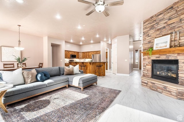8 S Arroyo Dr, St George, UT 84790 - living room with ceiling fan, recessed lighting, light marble finish floors, and a fireplace