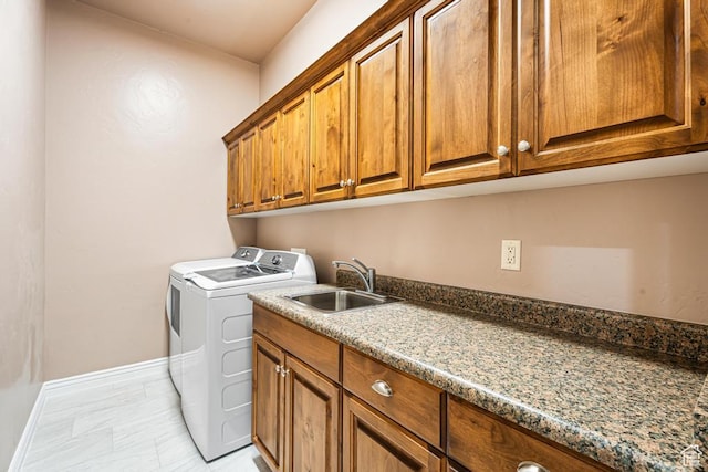 8 S Arroyo Dr, St George, UT 84790 - laundry room featuring washing machine and clothes dryer, cabinet space, baseboards, and light marble finish flooring