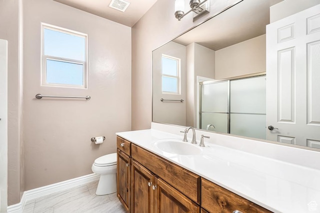 8 S Arroyo Dr, St George, UT 84790 - full bath featuring a stall shower, baseboards, toilet, vanity, and marble finish flooring