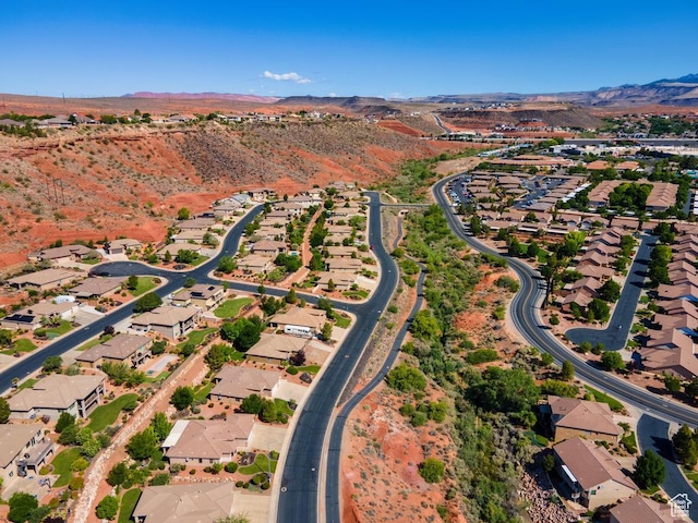 8 S Arroyo Dr, St George, UT 84790 - aerial overview of property's location featuring a mountain backdrop and nearby suburban area