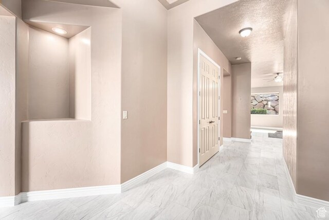 8 S Arroyo Dr, St George, UT 84790 - corridor featuring marble finish flooring and baseboards